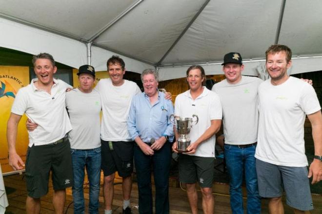 RORC Admiral, Andrew McIrvine presents the Multihull Trophy to the crew of Phaedo3, winners of the MOCRA Multihull Division in the 2016 RORC Transatlantic Race. Phaedo3 also took Multihull line honours having led the  fleet for all 2,865 miles of the race © RORC/Arthur Daniel